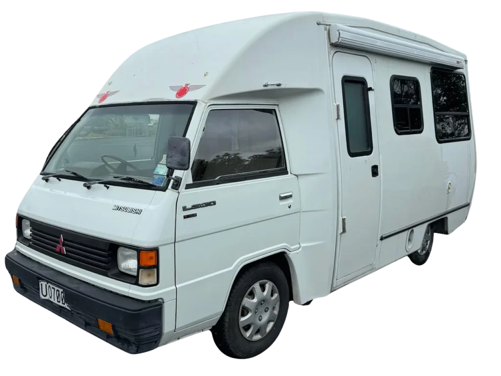 White campervan with mountain backdrop in Christchurch